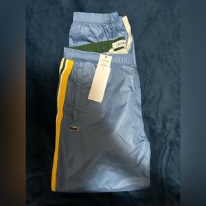 Blue Lacoste Track suit pants.
